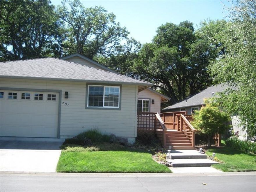 One owner home with private botanical garden in backyard. Single level, 2 plus bedrooms and 2 baths. Nice floor plan with separation. both of the bedrooms open to the back deck . Wired for a hot tub too. This home could easily be a three Bedroom but currently this large extra room is used as an office. Cozy gas Fireplace, Glass Cabinets, Light laminate flooring, Ceiling fan, fun neutral colors. Remember, HOA is $150.00 per month which includes, sewer, trash, front yard maintenance and Club house, exercise and game room, pool, Dog walk area... This is nice little spot to call HOME.