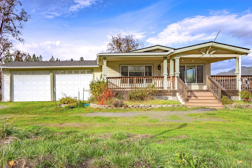 Recently remodeled and well maintained with a newer roof; 2-bedroom, 2-bathroom, office, 1,738 sq ft home set on 2.05 acres of flat, usable EFU-zoned land, located on a tranquil dead-end road. This inviting property features an attached 2-car garage and a wrap-around deck made from composite decking, perfect for outdoor enjoyment. There's an accessory building with a bathroom that provides versatile finished space. The home also includes a dedicated office, perfect for remote work or study. Additional highlights include multiple  other outbuildings: a detached 1-car garage with extra storage and a 20'x50' fully insulated shop with its own power service. The property is fenced by an 8' wood privacy fence and secured with a large rolling double gate entry. The well produces a robust 22 gallons per minute (per 2022 well flow test).  Call to schedule your viewing today!  (county assessor counts 3 bedrooms, likely counting the office)