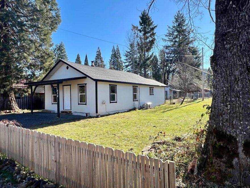 Charming 2 bedroom, 1 bath cottage in historic Butte Falls! This 947 sqft home on a .16-acre corner lot features fresh paint, laminate flooring, custom cabinets, newer carpet, and includes appliances—washer and dryer, too! Stay comfortable year-round with the mini-split system and wood stove. The fenced yard provides the perfect space for gardening, pets, or outdoor entertaining. Ideally located near parks, schools, and the local market, this home is also a dream for outdoor enthusiasts, with easy access to fishing, hiking, and hunting opportunities. Don't miss this charming retreat in a serene, small-town setting.