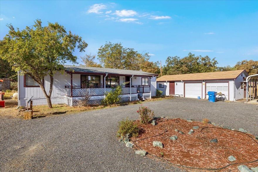 Back on market at no fault to the seller. Check out this well kept 3 bedroom 2 bath manufactured home on 1.48 acres. Located close to town, but far enough out of town for a little serenity. The home offers an open concept floor plan w/split bedrooms. The master bath has a soaking tub/shower combo & a large linen closet. The Jack & Jill guest bathroom offers easy access from either the hallway or laundry room. Kitchen offers plenty of cabinet space & a breakfast bar. Unique propane stove for cooking. Home has a new roof, new water system, new water heater & a new heat pump/AC. Detached 2 car garage w/attached finished bonus room. Bonus room is approx. 20' X 13' w/installed stove vent in roof so a wood stove can be installed if desired. The property also offers RV parking on the side of the home, a 8 X 6 gardening shed, carport w/cement slab, additional covered storage in the back of the property attached to the bonus room & a holding tank.  This home and property has lots to offer!