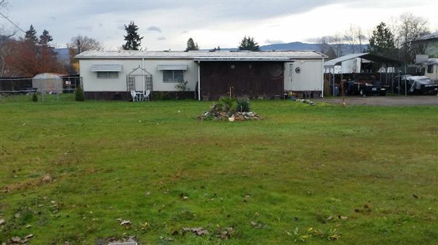 Owner is extremely motivated to sell. This is .84 acres of SFR-10 off west main. It has a double wide on it that is currently being rented. This would make a beautiful Homesite has all services with development potential. Zoned SFR-10 Bring offers