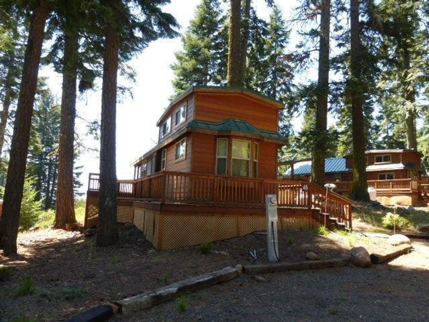 Own your own cabin at picturesque Hyatt Lake Resort with easy access to the lake. Enjoy year round activities: fishing, boating, mountain trails, snowshoeing, cross country skiing, snowmobiling, etc. Owner has a 1/22 ownership in 30.18 acres of land. HOA dues are $285/month and includes TV, internet and snow plowing. The cabin has one bedroom, one bath, kitchen and large loft area. A rental pool is available with management, rates run from $179 to $199 per night. Association has provided an area for RV parking for guests. Cabin is completely furnished.