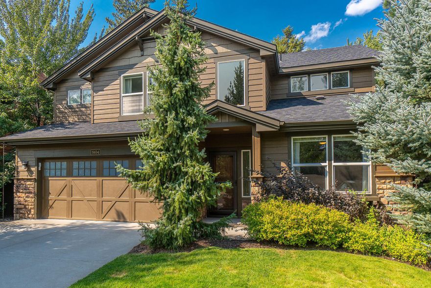 Modern luxury shines in this sun-filled, south-facing home on a quiet, tree-lined street in desirable SW Bend. Seller offering $15,000 buyer credit toward closing costs or rate buy-down!! Extensively remodeled, it features striking custom steelwork, concrete counters, and a rustic wood accent wall in the soaring two-story great room. The main-level primary suite offers a recessed TV and custom walk-in closet, with a nearby den. Bright kitchen with stainless appliances, counter seating, and ample storage. Gorgeous flooring throughout. Upstairs includes a spacious loft, three bedrooms, and a full bath. Mature trees frame the serene, easy-care backyard with paver patio and built-in gas firepit. HOA provides front yard maintenance, pool, park, playground, pavilion with fireplace, sport court, and more, all just blocks from the Deschutes River Trail.