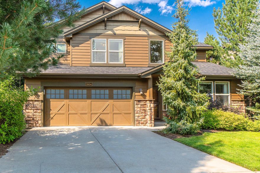 Modern comfort meets custom style in this sun-filled, south-facing home in SW Bend. Extensively updated with steelwork, concrete counters, and a striking rustic accent wall in the soaring, two-story great room. Gorgeous cork flooring, newer carpet and interior paint throughout. The main-level primary suite includes a recessed TV and custom walk-in closet with spa-like ensuite featuring a large tile shower, sleek dual concrete vanities, and modern fixtures. The bright kitchen is designed for both style and function with stainless appliances, counter seating, and abundant storage. Upstairs, find an open spacious loft, 3 additional bedrooms, and full bath. Relax or entertain in the low-maintenance, private backyard with paver patio and built-in gas firepit. HOA includes front yard care, pool, park, playground, pavilion with gas FP, and more. Conveniently located only blocks to the Renaissance Ridge Park, Deschutes River Trail and just minutes to The Old Mill.