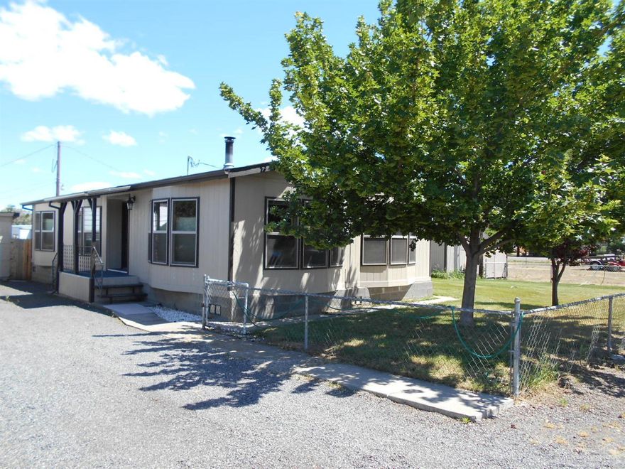 Manufactured home sits on a large flat lot close to shopping, schools and restaurants. Full block perimeter foundation, forced air heat, open floor plan and more. Single car detached garage with big storage room/shop area and single car carport.