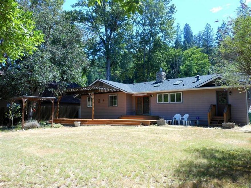 Lovely creekside setting on this recently remodeled rancher with river rock accents, bay window, deluxe lighting controls, gas log fireplace, generous use of skylights along with lots of windows and a beautiful French slider out to an expansive deck overlooking East Evans Creek make this a home that will surely please even the most discriminating buyers at this price point.