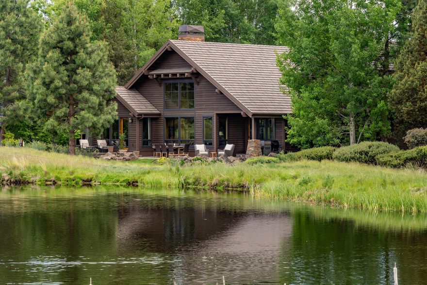 Architect-designed home on the 17th green at Broken Top, sited to provide privacy & peacefulness w/ lake & fairway views. Spacious home w/ European flair; high-quality finishes & beam work throughout. Inviting great room w/ high ceilings opens to casual dining & well-equipped kitchen w/ Wolf 6-burner range, secondary oven/microwave & Sub-Zero fridge, wet bar & wine fridge. Around the corner lies intimate dining room & temp/humidity controlled wine room. Main level master suite w/ vaulted ceilings & lovely views. Spa-worthy bath w/ air bubbler soaking tub & shower w/ dual heads.  Heated floors w/ double vanities & closets. Main level office w/ French doors & built-in bookshelves. Upstairs, an open library loft leads to 2 en-suite bedrooms & 3rd bedroom currently used as a flex/media room. Upper deck w/ scenic treehouse views. Natural light from many well-placed windows provides views of golf course & wildlife. Security system & built-in speakers. 3 car garage w/ cabinetry & epoxy floors