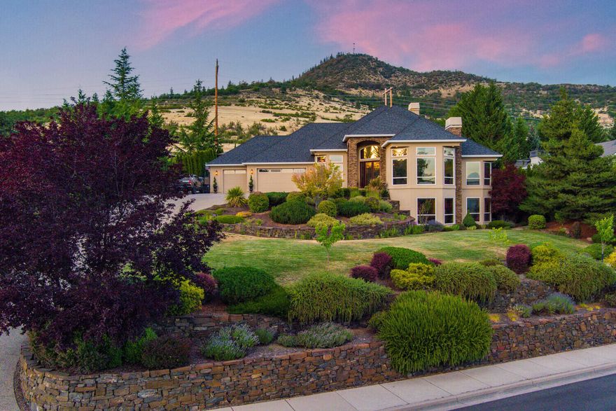 Spacious, Custom, View home w/everything you want! Elegant glass & wrought iron doors open to the light-filled entry, living, dining & gourmet kitchen/great room all with gas fireplaces. Lg windows & 20 ft. ceilings showcase magnificent Views & the home automation system provides control of the temperature, lighting & music. In addition the main floor continues custom finishes in the private master suite, office, powder rm as well as 2 add. bedrms w/Jack and Jill bath, laundry rm & convenience of attached 3 car heated garage w/epoxy flooring. Built-ins, storage & space abound including a downstairs hosting a media rm w/sound system & wet bar, 4th bdrm & full bath, 2nd office, craft & exercise rooms, 500 bottle wine cellar & game room w/another fp & blt-in wet bar. Both floors access the outdoor heated inground pebble tec pool, pool house w/guest bath & covered seating & protected pool equip.; lg patio w/woodburning fp & BBQ area; fenced 50 ft RV pkg & a generator. Schedule tour today!