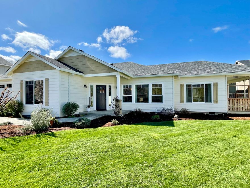 Energy Star craftsman home with so many desirable features — all single level, over 2000 sqft, 4 bedrooms, built in 2012, wood laminate & tile flooring only (no carpets!), open floor plan, granite counters, gas range, jetted soaking tub, on a beautifully landscaped .24 acre lot. 4th bedroom was built to be a professional sound studio with extra insulation & separate entrance perfect for private professional office space or audio/visual studio. The huge front yard has unimpeded mountain views due to lot bordering non-developable open space. Back yard is fully fenced with garden beds and young cherry & peach trees. The great room is spacious with coffered ceiling & ceiling fan in living room, open kitchen with breakfast bar, and dining area with slider to covered patio. Owner's suite has entrance to back yard and ensuite bathroom with large jetted soaking tub, double vanity and large walk-in closet. Private end-of-the-street location in one of Talent's most sought-after neighborhoods!