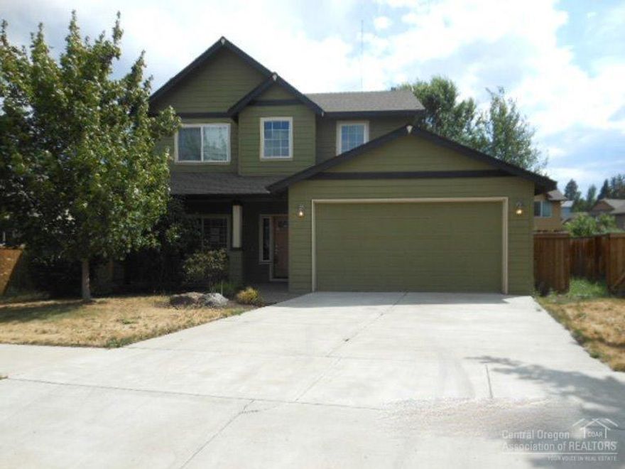 SOLD-AS-IS-See attached docs for more information on $500 credit toward Home Warranty of buyers choice. Buyer must request home warranty credit on the offer, it is not automatically given. Great 2 story home located in NE Bend, 2079 sq ft, hardwood flooring, tile counters, gas fireplace. Sliding door leads out to backyard. 2 car garage located on .13 of an acre lot.