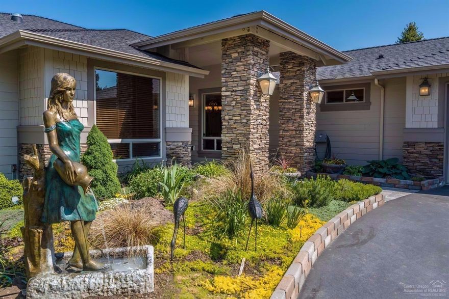 Stunning custom home, paver lined driveway w/inset design & entry. Open concept arched room & hall entries, Bamboo hardwood flooring w/walnut inlay, grand featured fireplace, display cabinetry, 5 point surround system in great room & deck providing perfect setting for Alfresco entertaining. Large kitchen, 2 islands, slab granite counter tops & walk-in pantry. Spacious Master Suite, soaker tub, 6 headed adjustable shower feature & huge closet. A Home To See, Ask Your Agent to print the Special Features List!