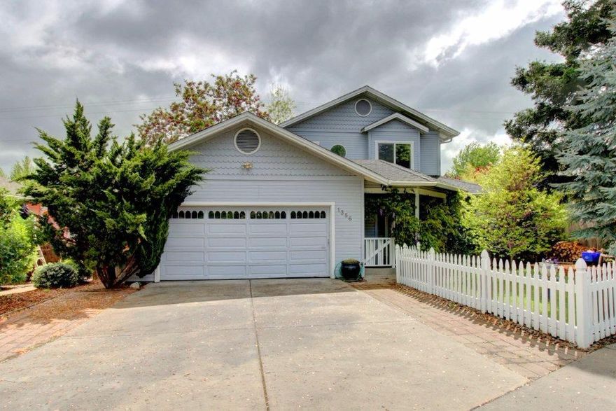 Wonderful Ashland Home Located in the Desirable Clear Creek Estates Area. Very tranquil setting with the creek across the street, front yard under the Giant Redwood & lots of off-street parking; fantastic fruit trees in back including a grafted Cherry growing 5 different types on one tree, a private deck, raised organic flower beds, a wall of Bamboo for privacy and a Koi pond. Master suite is on the main level - enjoy a good soak in the elevated bathtub with views of the surrounding mountains. This open floor-plan concept lets you enjoy the real wood-burning fireplace in all the spacious living areas. Upstairs features include built-ins for lots of storage and you can relax in the seated window or on the unique and super-private upper balcony, listening to the soothing sounds of the pond. Real Oak hardwood and ceramic tile floors make this home very comfortable. Close to all Ashland schools and the Farmers Market. Tour today!