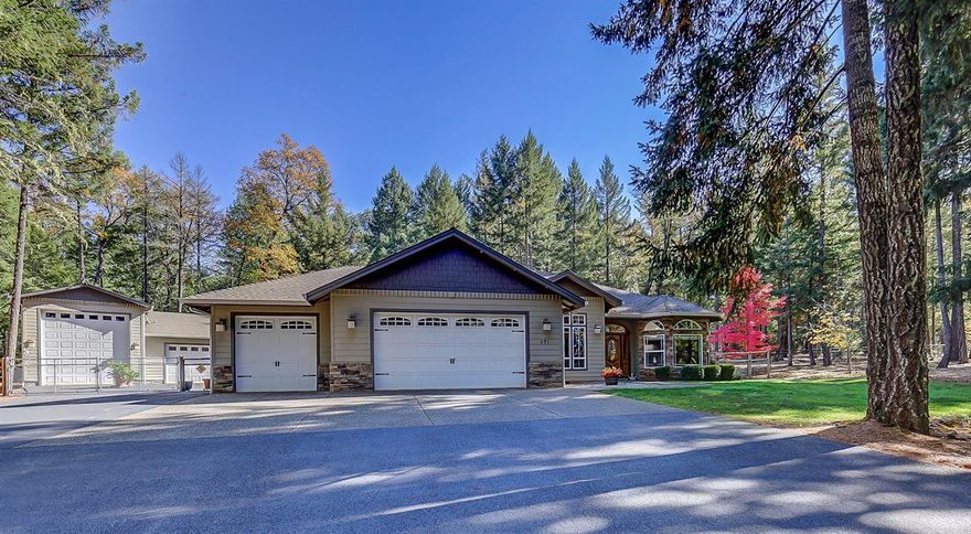 Beautiful Park like Setting in quiet, upscale Subdivision! Sitting on 2.5 acres in private cul-de-sac, this stunning home w/rock face accents was Built in 2004 by Kirk Chapman Construction. Elegance throughout, home features 3 bdrm, 2.5 ba, approx. 2448 sqft, beautiful kitchen w/wood floors, granite counters, propane/electric R/O, stainless steel appliances, pantry, nook, eating bar, lrg open living rm w/propane fp, entertainment center & surround sound. Formal dining rm, den, high quality appointments & features. Lrg Master bdrm w/ceiling fan & door to private patio. Master ba w/jetted tub, remote blinds, separate walk-in shower, tile & cultured marble & walk-in closet. Home is Handicap accessible! Attached 3 car garage w/sink & backup generator. Fenced backyard, covered back patio w/propane BBQ hookup & garden area. Detached RV garage w/2 car garage/shop attached, paved driveway w/lots of of extra parking. Only 15 mins to downtown Grants Pass. Home warranty included!