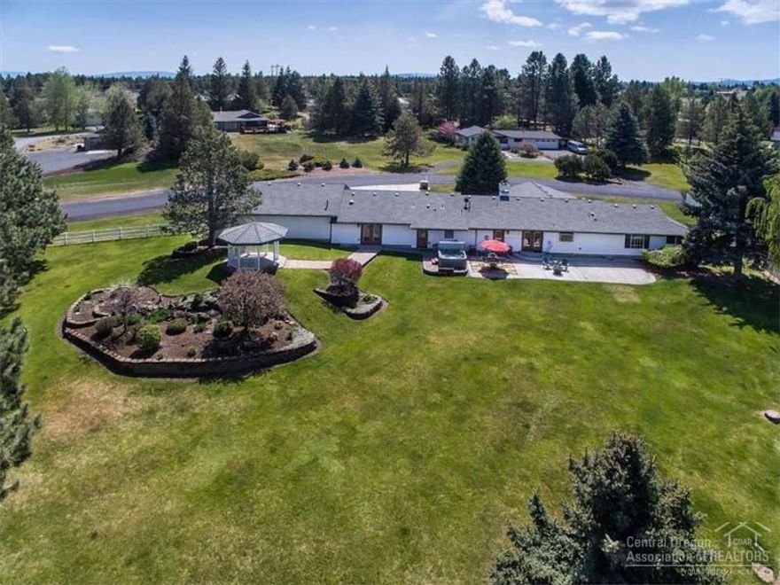 Large single level home sits on a flat acre lot in popular Dobbin Acres. Open floor plan with gas fireplaces in the living & family rooms. Updated kitchen with newer appliances, Two master suites, with ample storage. Finished over-sized 5-car garage with a shop area. Beautifully landscaped back yard, with a gazebo, feels like a park. Perfect entertaining or family space. Close to shopping, schools and eastside amenities.