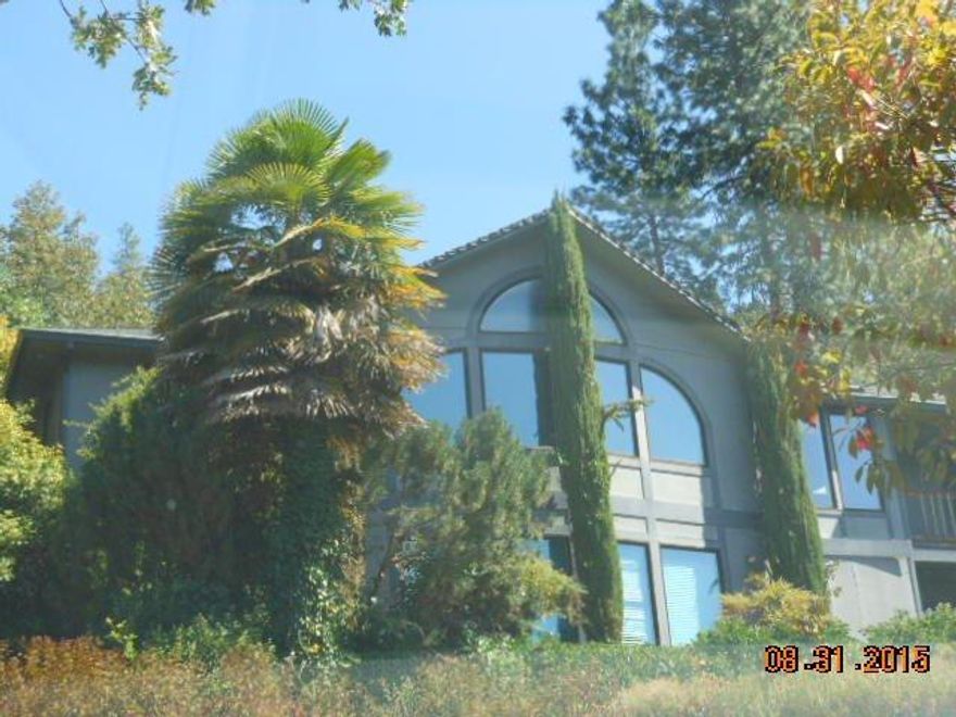 High on the hill overlooking the valley. Main level features Living room, dining area, kitchen, master bedroom, Laundry room, half bath and additional bedroom or office. Lower level features family room, full, bath and 2 bedrooms. Lower level walks out to pool area. Upper level has extensive decks and windows to capture the valley view. Home is offered in current as is condition and will need some TLC. Home has an attached 2 car garage with large storage area plus a detached garage/shop that is approximately 1080 Sq ft with access on both sides. Come explore the possibilities.