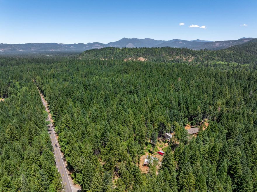 Beautiful level 5-acre homesite zoned RR-5 with a 20 gallon per minute well (per well log on file). The property is densely forested with approximately 100 -125 MBF of merchantable timber and backs to over 175 acres of BLM land. Check with Josephine County for development options.