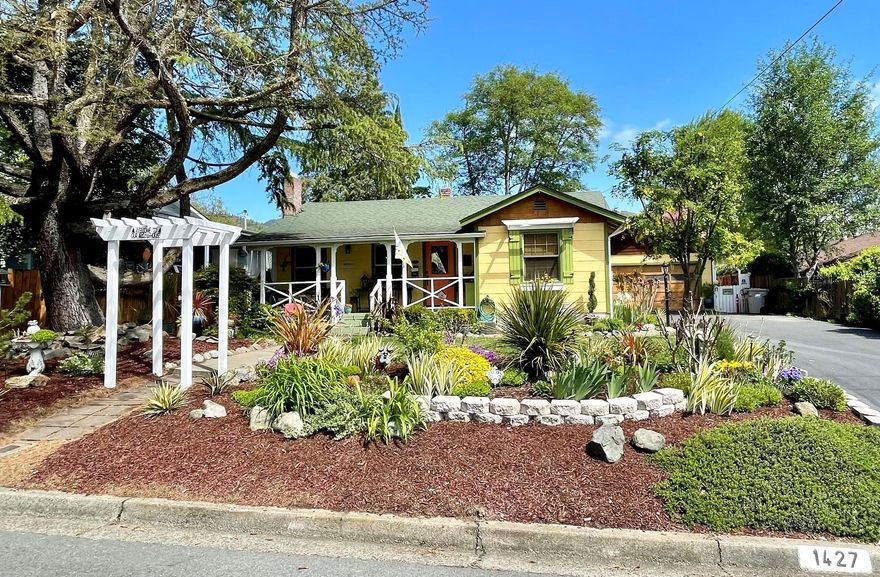 Beautiful Bungalow with expansive gardens front and back!  This picture perfect ''jewel box'' has been lovingly cared for and improved upon by the owners for many years.  From the moment you approach the covered front porch you know you are in for something special- AND it is located on the coveted street of Washington Blvd. This 3 bed, 2 bath features an open floorplan with hardwood floors, gas fireplace in the living room and good sized kitchen with movable island and lots of storage. All new vinyl windows throughout. Guest room and full bath, master bedroom with small bathroom and tiled shower.  There is a 3rd ''bedroom'' currently used as the family room which has newer bamboo flooring.  The kitchen and family room look over the wonderful gardener's paradise the sellers have created......walking paths, fountains, covered patio, wonderful flowers and trees.  2 car garage with work bench. You will be pleasantly surprised!  More pictures to follow.