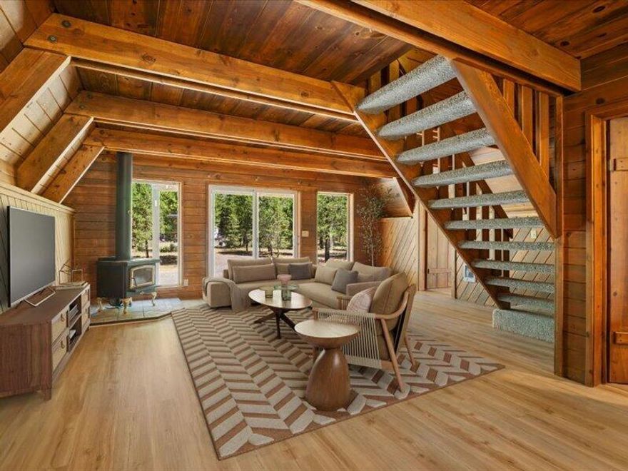 Charming classic A-frame cabin on a private 1-acre lot near the National Forest! This beautifully updated 3 bedroom retreat features a stunning wall of windows and a cozy wood-burning fireplace that fills the living room with natural light and mountain charm. Recent updates include brand-new LVP flooring and an updated kitchen with new cabinets and countertops. The flexible layout offers a bedroom and bathroom on each level, plus a spacious loft that could serve as a 4th bedroom or office. Outside, enjoy a large detached shop ideal for RV or boat storage, workshop space, and two garden sheds. Peaceful, private setting with room to roam. Looking for even more space and privacy? An adjacent 1-acre lot is also available for purchase, offering the rare opportunity to double your land and your tranquility.