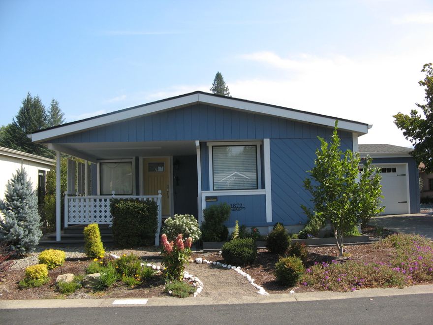 Beautiful manufacture home in Allen Creek Estates, 55 plus PUD. Inviting front porch to relax with guests. Newer roof, heat pump, floor coverings, blinds, pex piping. Newer kitchen with countertops, with marble backsplash, newer appliances. Vaulted ceilings, spacious great room, split floor plan. Deluxe master with appointed master bathroom, with shower and walk-in closet. Beautifully landscaped backyard with raised beds, sitting area, sprinkler system. Lots of storage with garden shed.