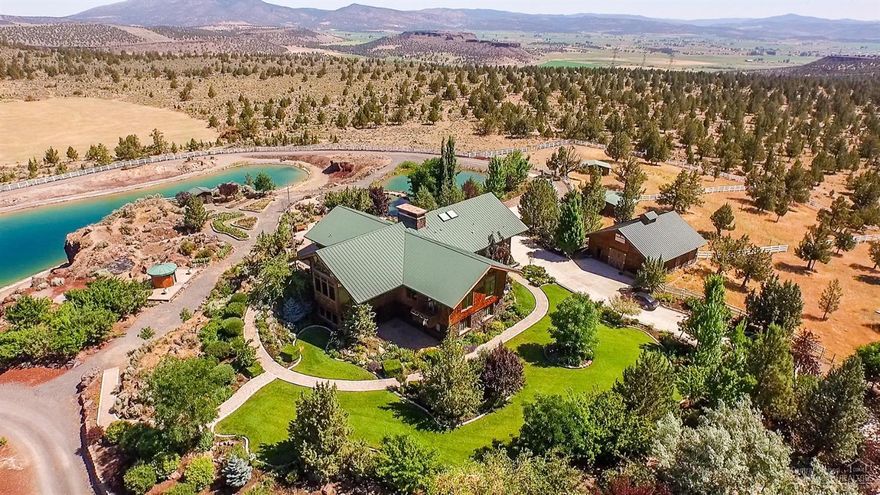 Excellence is the standard, not a goal at Mountain View Hay & Cattle Ranch in Powell Butte. The 8,499 sq ft executive home features 6 bedrooms and 4.5 baths, a wine cellar, and views that will exceed your expectations! An amazing 81,600 sq ft equestrian facility, 2 indoor arenas, one 120'x144' the other 120'x240', plus 117 horse stalls, an office, 3 large tack rooms and spectator judging areas. A great value and just reduced an additional $750,000! Priced well below replacement value.