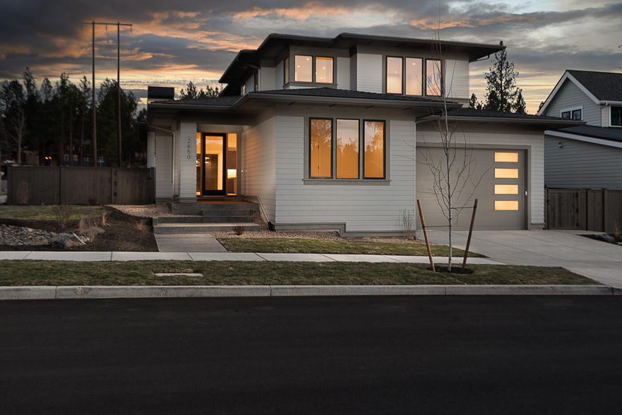 In the heart of the picturesque Talline community on a corner lot, this Prairie style home by Structure Development NW offers a blend of modern luxury and timeless charm. The exterior boasts classic Prairie style elements, including low-pitched roofs, horizontal lines, and large windows that flood the interior with natural light. Inside discover a thoughtfully designed floor plan that seamlessly combines open living spaces with cozy retreats. Open floor plan with great room, gourmet kitchen and dining area. Primary suite on the main level with three additional bedrooms and a bonus room upstairs. Home also features an office for remote working and a storage room in the garage for all your Central Oregon toys. 10' garage door height to accommodate taller vehicles. Outside, the beautifully landscaped yard and covered patio for outdoor living.