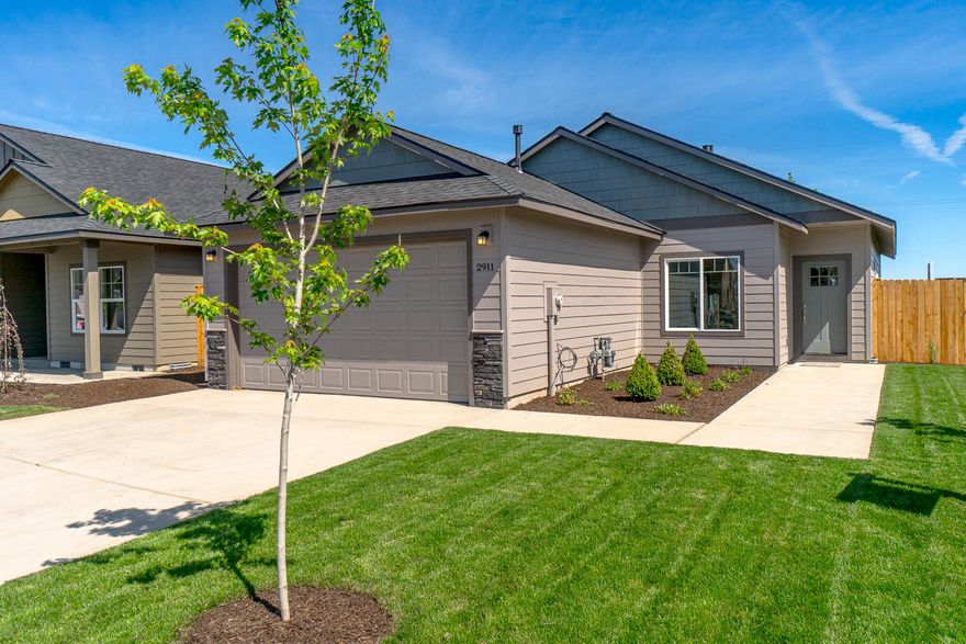 Premier 55+ mature living community in beautiful NW Redmond. Just minutes from amenities, medical facilities, the Dry Canyon, trails & parks. Well appointed home w/a comfortable Great Room style floor plan & Master separation. Open kitchen w/breakfast counter/bar, Quartz counter tops, designer tile back splash, SS appliances, refrigerator & a gas range. Knotty Alder cabinetry & classic hardware & fixtures. Engineered wood look flooring on the main living space & carpet in the bedrooms, luxury vinyl plank in the baths. Spacious living room w/gas burning fireplace & plenty of space to entertain the whole family or lg furniture! Master Suite features a tray style vaulted ceiling & huge walk in closet via Mstr Bath, dbl vanities in the bath & glass shower door on walk in shower. High efficiency gas furnace & water heater, A/C installed! Double car garage, wi-fi garage door opener, front landscaping, auto sprinklers & fully fenced. Additional floor plans available.