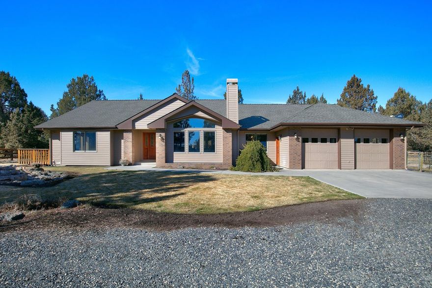 Bend Home on acreage, private park like setting. Property is 19.28 acres with 13 acres of Arnold irrigation water rights for pastures. Pastures are irrigated with wheel line and irripods, pond. Ranch Style Home is 2477 sq ft, 3 Bedrooms, 3 bathrooms, recently updated, single level, updated kitchen with new appliances, open floor plan, living room with wood burning fireplace, pellet stove, breakfast nook, pantry master suite with tile shower, walk-in closet, utility room, attached 2 car garage with work space. Home has a covered porch, landscaped yard, and water feature. Shop/Barn combination for livestock or can be RV storage with storage. Property is fenced and ready for livestock, gated and located under 10 minutes to Bend.