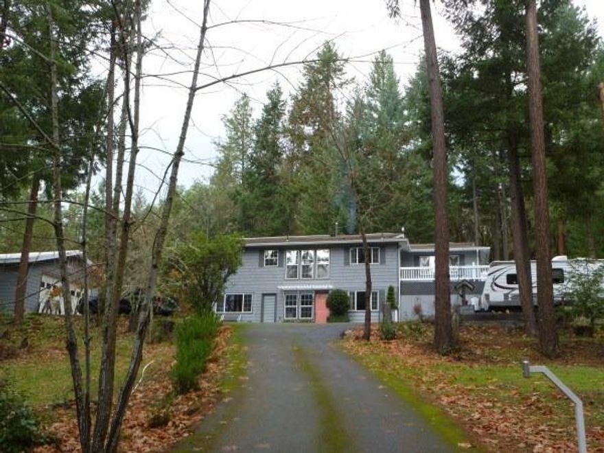 Has been extensively remodeled. Gourmet kitchen, beautiful decks, large fenced in garden, totally inviting environment. Comfort and beauty is everywhere. RV parking, security gate.