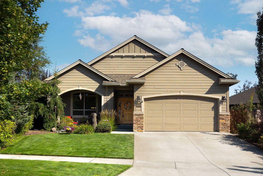 Welcome to 60974 Grand Targhee Drive in SE Bend. This gorgeous single level gem is nestled in a great neighborhood, and will soon have a new Park in close proximity (https://www.bendparksandrec.org/project/project155/). The interior includes a vaulted living room ceiling, floor to ceiling rock fireplace, windows lining the dining room and living room, and custom cabinets in the kitchen with an island eating bar. The spacious primary suite is also vaulted, and has a walk-in closet. The exterior includes covered front and back porches, a tranquil backyard setting for you to entertain, retreat, or enjoy all the benefits of your very own hot tub. Beautifully landscaped, this home exudes Pride of Ownership from the moment you set eyes on it. Don't miss out on this amazing opportunity. Schedule your showing today!