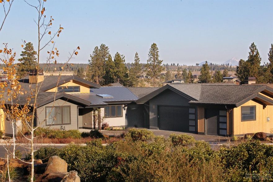 Price Reduced! This Contemporary Northwest custom designed home offers stunning views & a prime location in Tetherow's Cascade Vista neighborhood, built by Greg Welch, one of Central OR's leading builders. This home has 3 ground level bedrooms, 3.5 baths, a large downstairs bonus room w/ dry bar that can double as the 4th suite, an ample mudroom, office, & over 3,100 SF of living space on a mountain view lot. Not only is this home designed w/ contemporary finishes, light & bright spaces and a thoughtful floorplan to maximize views & livability, it also is situated in a prime Tetherow location allowing easy access & close, biking proximity to award winning schools, Bend's westside & vibrant downtown. While Bend has consistently been named one of the best places in the country to live, Tetherow Resort & community could be the best place to live in Bend, comprised of 700 acres on the desirable westside.