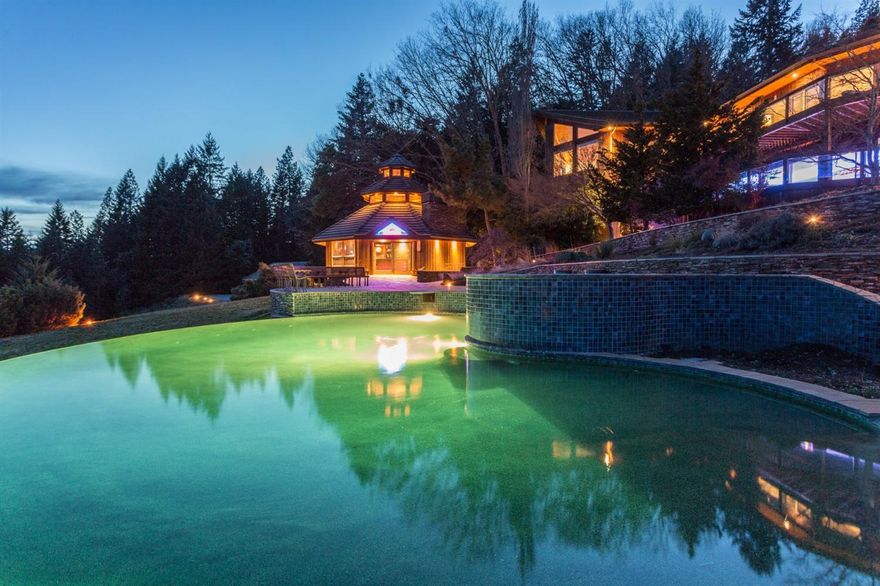 Exclusive Southern Oregon Multi-Family Estate on 83 acres. Overwhelming views of the Southern Oregon Cascade and Coastal Mountain Ranges. Endless edge pool w/hot tub, custom slate rock paths and decking, pool house w/commercial style bar, full kitchen, BBQ and his/hers restrooms/showers. Custom designed home theater w/high capacity luxury seating, snack bar and gaming lobby. Towering entry Atrium features approx. 40yr. old Giant Bird of Paradise plant w/it's own climate control system. Additional farm house/guest residence is uniquely crafted w/tongue in groove walls, dormers, screened front porch, gardening area and it's own detached garage. Main residence is over 10,000 sq. ft. of exposed beams, tongue in groove ceilings, vaults, hardwood floors, gas fireplaces, commercial kitchen w/cook-top, Corian style counters, island bar and dual dishwashers. All designed to capture views from every room and entertain large groups. Detached 3600sq. ft. finished garage w/lift fits approx 20 cars.