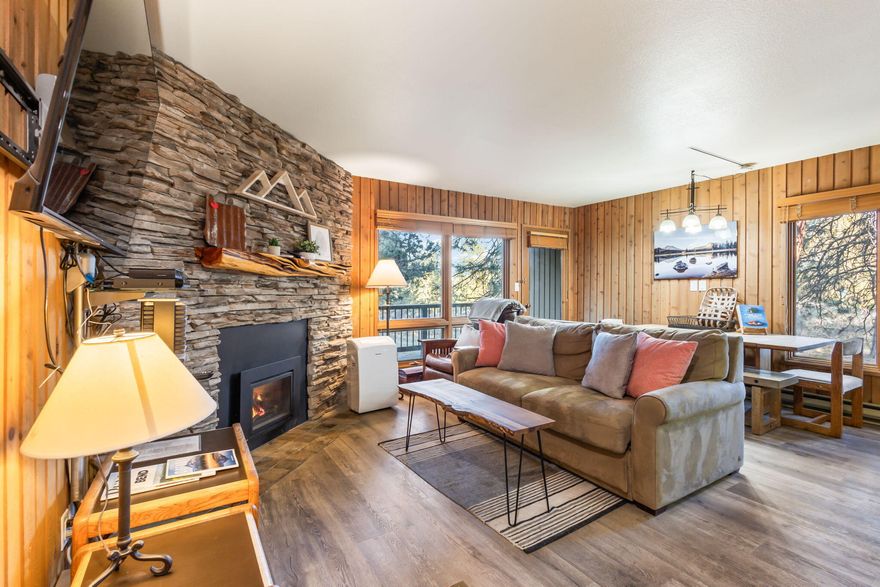 Experience the perfect fusion of convenience, comfort and style with this Mountain Modern, Short Term Rental condo in Bend's Mount Bachelor Village. An end unit, located on the ground floor, this home is a stone's throw from downtown Bend, the Old Mill District, and the slopes of Mount Bachelor. Enjoy the luxurious amenities, including a pool, hot tubs, a clubhouse, and trails along the Deschutes River. The private back patio offers a tranquil space to relax amongst the old-growth trees. Interior has been fully updated with large stone fireplace, new paint, kitchen and bathroom. Ideal for full-time living, a vacation escape, or as a lifestyle investment with nightly rental potential. Don't miss this opportunity to own a coveted piece of Bend history!