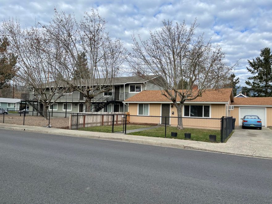 Call all your investors.  Here's a perfect 1031 exchange property.  Property consists of 2 tax lots-  a renovated 6 unit apartment complex on one tax lot and a 2bed, 1 bath, 1218 sf home with 1 car garage on adjacent tax lot.  Both structures are attached by a common wall. The 6 unit complex has approx. 4632 sf and each units have 2 bedrooms, 1 baths, and have been renovated. There's wall ac and wall elec. heat, new roof, new exterior paint, units have balcony or patio, and low maintenance. landscaping.  Off street parking with access off alley.  There's also a coin op laundry facility.