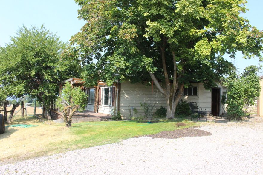 NEW PRICE   Alfalfa, pasture, home, barns and shops with a view of the mountains and Agency Lake on 20 acres. Water Rights from a private permitted irrigation well with wheel line & pods.  3 Bedroom 2 Bath Manufactured home.  METAL SHOP with drive through doors. hay barn, stalls for animals and an oversized 2 car garage with concrete floor. A cold storage room with cutting & wrapping room.   All fenced and crossfenced. Could have  cattle ,horses sheep what ever you like.  Plus a nice stand of alfalfa. Multiply  fruit trees and a berry patch. This area is known for growing a nice garden. So call today and come take a look. Move in ready. Home is vacant can show any time.