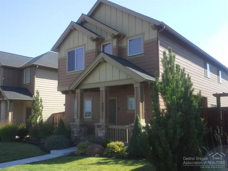 Extra special! 3 bedrooms and a bonus room which could be a den or family room. Two and a half baths. Cozy natural gas fireplace in the living room. Harwood in the kitchen and dining room. Tile counters. Side yard is fenced. Relax on the patio. Take in the surrounding hills and park-like neighborhood of Ochoco Pointe. Central vac.