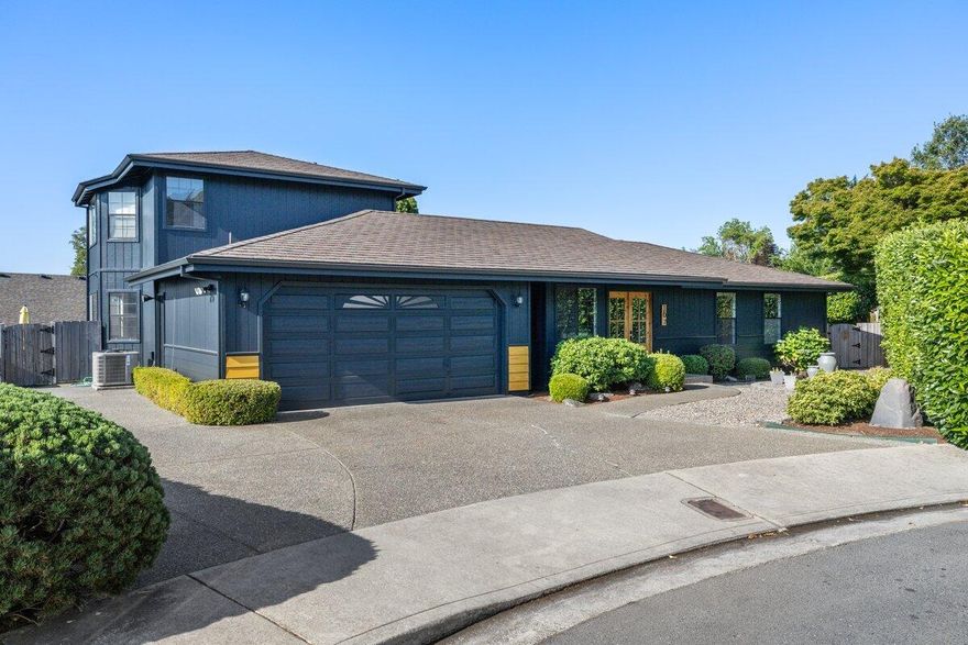 Impeccably updated, this 4-bedroom, 2-bathroom home in the sought-after NW neighborhood of Grants Pass is a rare find. Situated on a spacious .31-acre lot, this home offers modern amenities and a peaceful location on a quiet cul-de-sac. Its prime location near District 7 schools, restaurants, and shopping makes it an ideal choice for families. Enjoy plenty of storage space with a 2-car garage, RV parking, and a large storage shed with a loft. The property also boasts a newer heat pump and smart thermostat, as well as fresh interior and exterior paint. The remodeled kitchen features a large gas cooktop, built-in oven, microwave granite counters, and a beautiful large center island. The family room with a cozy gas stove leads to the stunning backyard and deck, perfect for hosting gatherings. Relax in the gazebo and take in the breathtaking view of the  Mountains.The upstairs primary bedroom features its own balcony and a luxurious en suite bathroom with a double vanity. Motivated Seller
