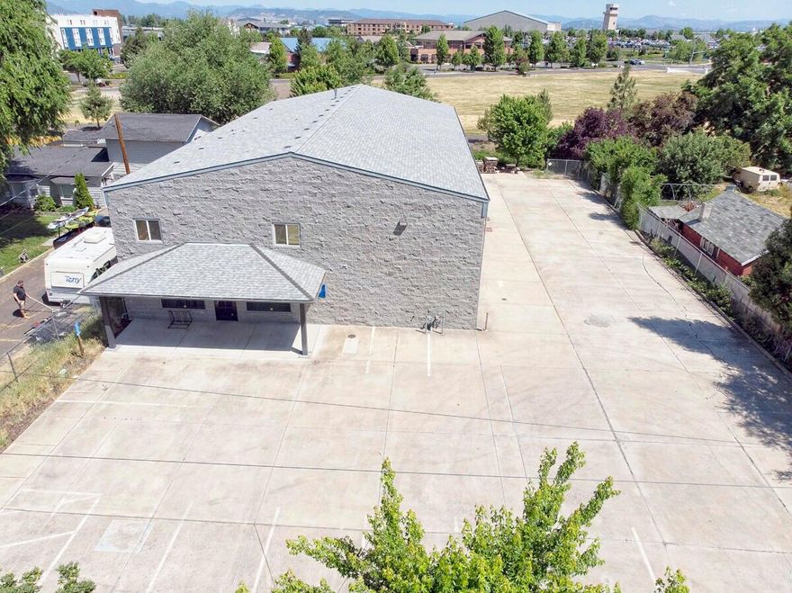 Welcome to this exceptional commercial building located off a busy well traveled road, boasting outstanding curb appeal! With its prime location and i-G zoning this property invites you to unleash your business imagination, whether you envision a mechanic's shop, or something else. The 1st floor includes a showroom, office area, restrooms, employee break room, and abundance of storage space. the 2nd floor features a spacious finished apartment complete with equipped with 2 14 x 14 roll up doors. Office furniture, including desks, chairs, shelves equipment etc. on site are negotiable