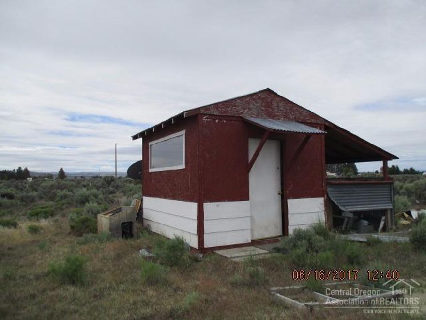 Price Reduction! Looking to build you a nice place. Well this one has the septic already installed. Just hook up the water & power, which are at the property line to your new build. Just out of town so you can enjoy the beautiful sunsets, wildlife and more. Property has a small storage building on it as well. Fenced and gated to keep that puppy inside. Buyer do your due diligence-especially land use.