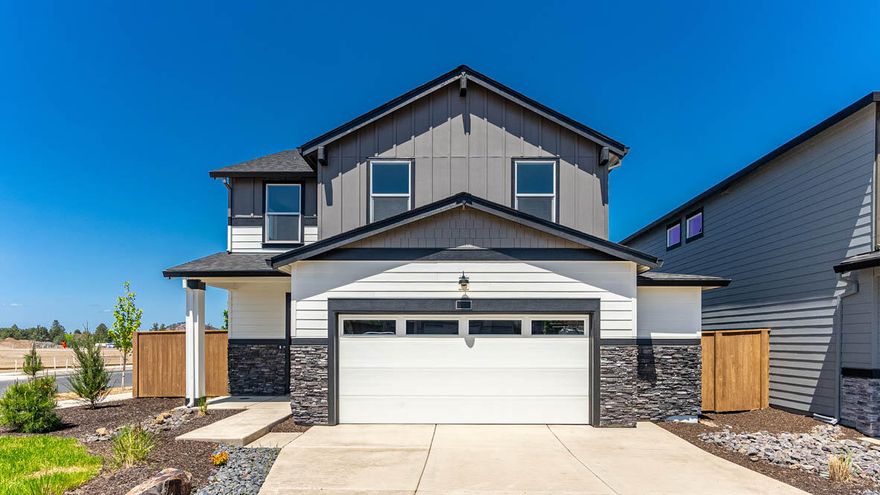 Welcome to the Porter floor plan at Stevens Ranch in Bend, Oregon! This 1,905 sq. ft., two-story home offers 5 bedrooms, 3 bathrooms, and a 2-car garage. Upon entry, find a storage closet and access to the garage. The main floor includes a bedroom and full bath with a tub/shower—perfect for guests or a home office. Enjoy cozy nights in the great room with a fireplace, open to the dining area and stylish kitchen featuring shaker cabinets, quartz countertops, and stainless-steel appliances. Upstairs, the primary suite and 3 additional bedrooms are joined by 2 full bathrooms. BUYERS: Boost your buying power with a special reduced interest rate and thousands in builder-paid closing costs! You won't want to miss seeing this incredible home and experiencing the savings. Reach out today for a private showing.
