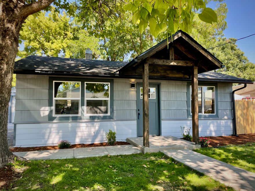 Charming 2 bd in SE Grants Pass ready to be your new home! Completely remodeled with many extras! New luxury vinyl plank flooring throughout, stainless appliances, granite countertops and beautifully tiled backsplash along with crisp white cabinets and modern fixtures top off the fabulous kitchen. Great roomy floor plan, master bdrm has sliding door leading to huge backyard with gorgeous stamped concrete walkways.  All new vinyl windows, roof and gutters, as well as a mini-split heat/AC for efficient temperature control. This perfect starter home also boasts a single car detached garage and nicely landscaped, fenced front yard, plus additional alley access/parking.  Must see, this home will go fast!  
Note: Seller is related to Listing Broker