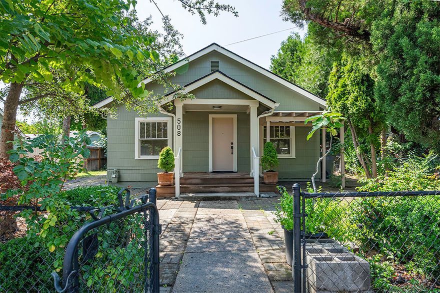 Adorable Craftsman cottage!  So much charm and character! Clean as a whistle and move in ready.  Freshly painted inside and out and all new flooring. Pleasant, nice sized fenced yard with mature landscaping. Long driveway, possibly big enough for RV parking. Plus, there is an approximately 192 sq ft outbuilding which could be used as a guest house or a shop. Great opportunity for first time homebuyers and investors.