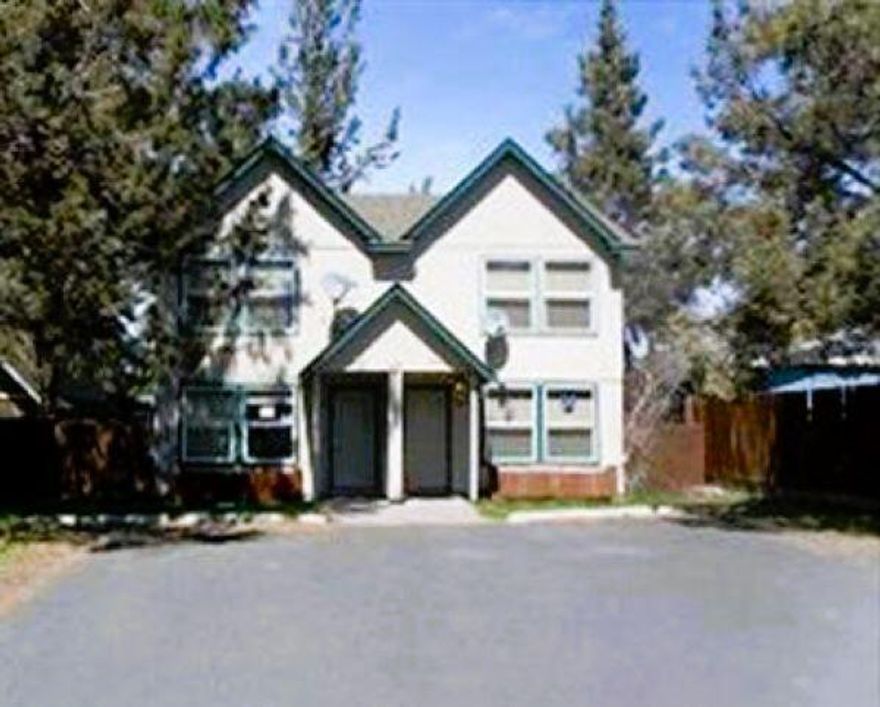 Don't miss this fantastic chance to own an investment property near everything. This Duplex perfectly situated in a prime Bend location. Close proximity to the Old Mill District, Box Factory, Deschutes
River, Crux, and more, this property offers convenience of location. Enjoy nearby summer concerts, quick access Parkway, living just one block from COB bike route. Each unit has 2 bed 1.5 bath and 992 sq. ft. Formica countertops and Pine cabinets. Small deck off the dining area in the fenced backyard. Laundry is upstairs. Currently both units re occupied.