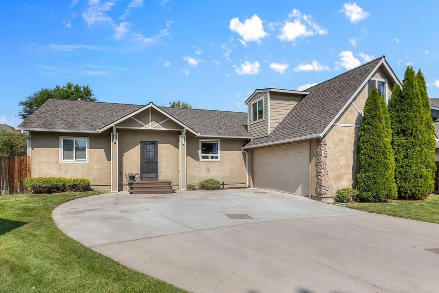 Beautifully maintained home nestled on an oversized lot in a quiet cul-de-sac. All bedrooms are conveniently located on the main floor, with a spacious bonus room or home office above the garage. Soaring 13-ft vaulted ceilings enhance the open-concept living area and primary suite, creating an airy, light-filled space. The living room features a cozy gas fireplace, custom built-in bookshelf, and abundant natural light. The kitchen is both stylish and functional with granite countertops, tile backsplash, pull out cabinet organizers and a center island perfect for cooking or gathering. The large primary suite offers a walk-in closet and a beautiful bathroom with a double vanity, tiled shower, relaxing soaker tub, and private water closet. Step outside to enjoy the large fenced backyard, complete with a garden area, private patio, and space for RV or boat parking. All just blocks from Redmond's new food truck destination, Dry Canyon Club—this home truly has it all!