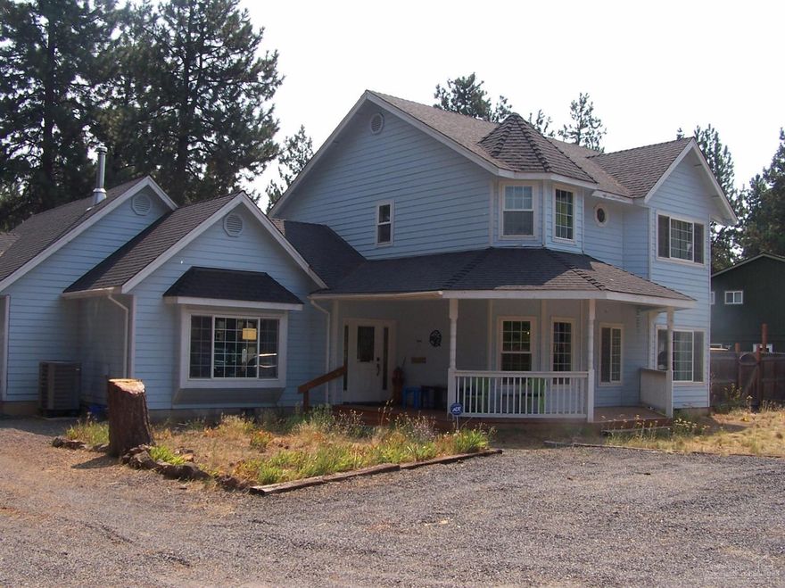 Beautiful Victorian style home nestled in the pine trees in SW Bend. Over sized 2 car garage and covered front porch. The easy living floor plan features the master suite on the main level, large bonus room upstairs, 2 full bathrooms and 2 half bathrooms. RV parking, Forced air heat with top of the line heat pump to maximize efficiency. Includes a Newer Blaze King wood stove to heat those cold winter nights. Recent updates to Master bath and Kitchen Flooring