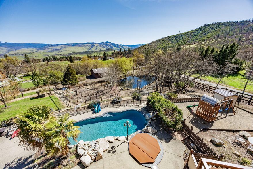 .Experience a place that transcends the ordinary, where nature's rhythms become part of your daily life. This exceptional property offers breathtaking views, magnificent craftsmanship, privacy, and multiple spaces that beckon you to pause and savor life's moments. Meticulously designed, the home blends indoors and outdoors with expansive windows framing the surrounding beauty. Multiple decks provide outdoor options for views, shade, or sun, depending on the weather, and your mood. Outside, a saltwater pool with beach entry invites relaxation. The year-round private pond is fed by a natural spring. Outbuildings include a 4-stall barn, multiple garages, and a playhouse with electricity. 
Yet, this home's essence lies not just in its features, but in the feelings it evokes. Here, connections deepen, stress decreases, & time slows, allowing you to embrace life's simple pleasures. More than a residence, this is a true sanctuary—a place that encourages slowing down and taking deep breaths.