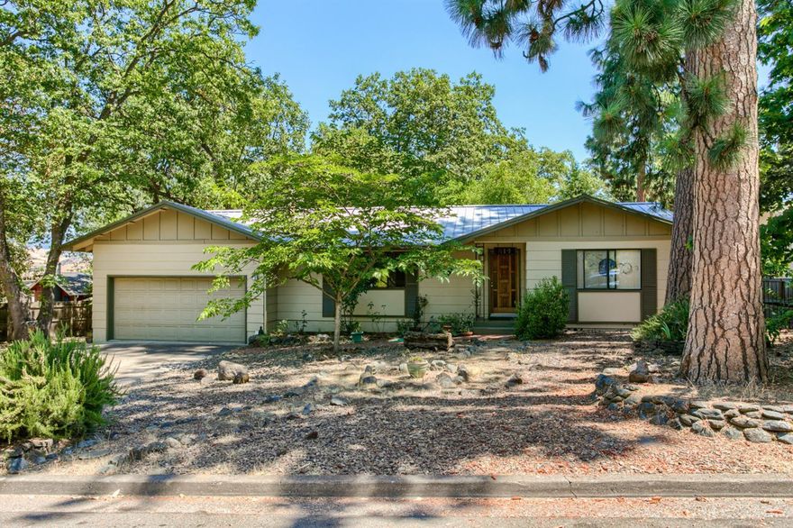 Wonderful, single-level home on a large .27 acre, flat lot just above the boulevard! This 2BR/2BA, 1436 SF home is in a highly desirable area & has a very usable, efficient layout. Upon entry, you'll be greeted by a large family room with a brick, gas fireplace & large window looking out upon the tree-filled front yard. Adjacent to the kitchen area is a nice-sized laundry room w/exterior access & also a very sweet dining space that features double doors going out to the deck space. While you're lounging on the deck, you'll overlook a large, fully-fenced backyard w/mature trees & a nice garden area w/raised beds. Other features include a new HVAC system in 2016, aluminum roof & concrete siding. Close to the bike path, SOU, schools, trails and shopping.