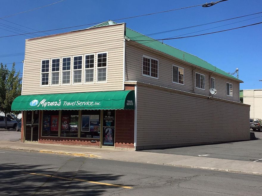 Offices and Apartments! Approximately 1500 square feet of office space on the main level and two apartments upstairs. One apartment is a two bedroom, one bathroom unit and the second is one bedroom, one bathroom. Large windows and many built-ins. Come see to appreciate.