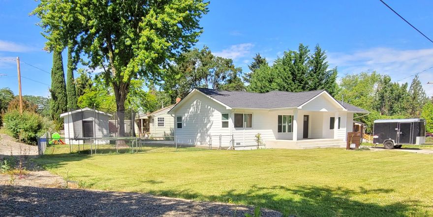 Beautifully updated 3-bedroom 2 bath. This home sits on an .18-acres corner lot with a fenced back yard that is well maintained. Newer covered concrete patio in the back and on the front porch. Looking inside you will see LVP through out the living room, kitchen, and bathrooms and carpet in all three bedrooms. Kitchen has new cabinets, quartz counter newer stainless-steel appliances. Both bathrooms have tiled showers, new vanities and toilets. Sheet rock, texture, and base board throughout the whole home has all been replaced and painted. New windows, doors, garage door, 40-year architectural composition roof, siding, exterior paint, and gutters. Mini split heating and air conditions adequate for 1500 sq. ft. 130 Sq. Ft. shed in the back is also newly built. All updates were done in 2020 and after.