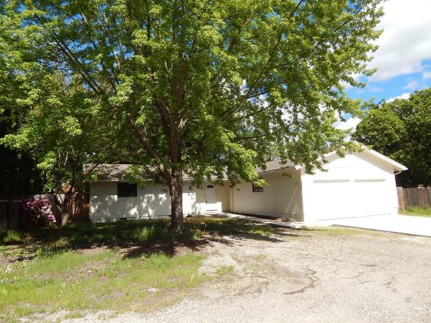 Beautifully updated East Medford home. This three bedroom, two bath home features a updated, modern kitchen, new paint, new flooring, new garage doors, and new concrete patios. The living room boasts a slate fireplace. Sliding glass doors open to the back patio. The master suite features his and hers closets and French doors to a separate back patio. A two car garage provides plenty of parking. The fenced backyard is perfect for outdoor entertaining. Listing agent is related to Selling company's President.