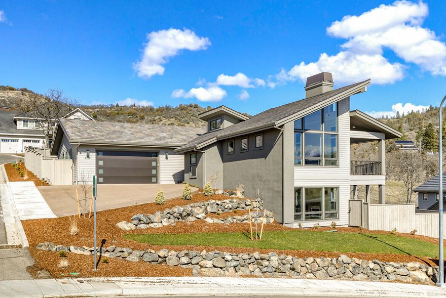 Beautiful views of the valley from this new contemporary style home located in the premier Saddle Ridge development.  The great room has high vaulted ceilings and lots of glass to enjoy the views and abundant natural light.  Large, island kitchen with Kitchen-Aid appliances, quartz counters and a pantry.  The reverse living floor plan has the master suite on the main level.  The lower level has 3 bedrooms and a family/bonus room.  There is a huge, incredible deck that is an amazing outdoor living space.  Two gas fireplaces.  The two car garage is oversized.  All fenced and landscaped.  Earth Advantage certified for energy savings and reduced utility costs.